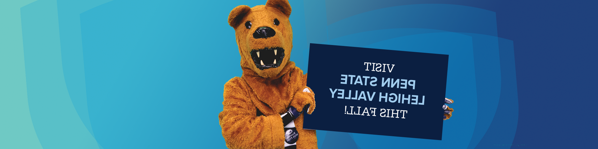 Lion mascot holding sign that says visit Penn State Lehigh Valley this fall!